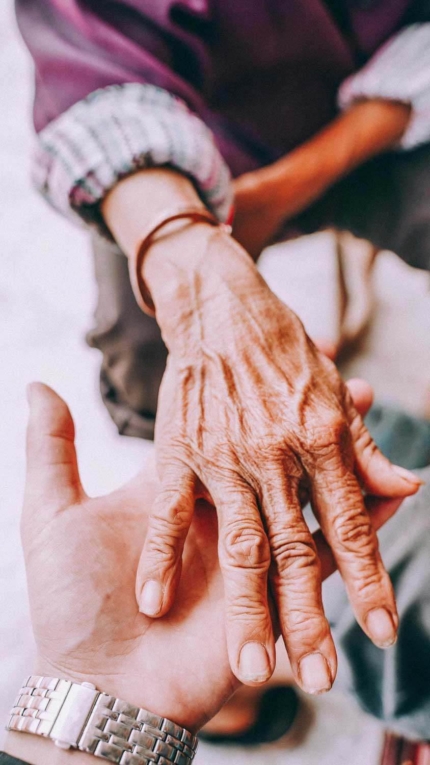 Care worker helping service user at home